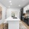 Photo of kitchen island with sink and ample cabinetry