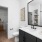 Bathroom vanity with framed mirror. Photo looks into large oversized closet.