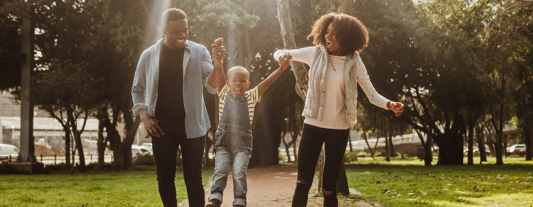 a family outdoors with smiles