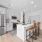 Gourmet kitchen with quartz countertops and built-in microwave
