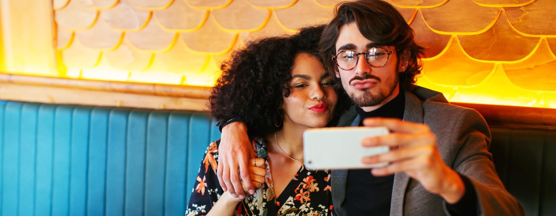 a man and woman taking a picture together